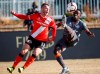 Hamilton Forge's Kwame Awuah, right, kicks the ball as Calgary Cavalry's Nico Pasquotti looks on during Canadian Premier League soccer finals action in Calgary, Alta., Saturday, Nov. 2, 2019.THE CANADIAN PRESS/Jeff McIntosh