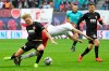 Augsburg's Kevin Danso, left, challenges for the ball against Leipzig's Lukas Klostermann, right, during the German first division Bundesliga soccer match between RB Leipzig and FC Augsburg in Leipzig, Germany, Saturday, March 9, 2019. (AP Photo/Jens Meyer)