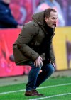 Augsburg coach Manuel Baum gestures during the German first division Bundesliga soccer match between RB Leipzig and FC Augsburg in Leipzig, Germany, Saturday, March 9, 2019. (AP Photo/Jens Meyer)