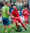 Toronto FC midfielder Michael Bradley (4) reacts to missing a shot on net as Seattle Sounders defender Brad Smith (11) looks on during the first half of MLS Cup final soccer action in Seattle on Sunday, November, 10, 2019. THE CANADIAN PRESS/Jonathan Hayward