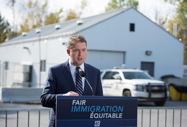 Conservative leader Andrew Scheer makes a morning announcement at the Canada/USA boarder on Roxham road during a campaign stop in Lacolle, Que. Wednesday, October 9, 2019. THE CANADIAN PRESS/Jonathan Hayward