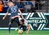Vancouver Whitecaps midfielder Russell Teibert (31) fights for control of the ball with New York City midfielder Keaton Parks (55) during the first half of MLS soccer action in Vancouver, B.C. Saturday, August, 31, 2019. THE CANADIAN PRESS/Jonathan Hayward