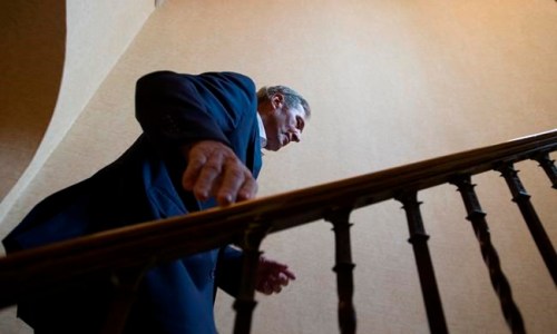 Manitoba Premier Brian Pallister goes up the stairs after addressing the media during a meeting of Canada's Premiers in Saskatoon, Wednesday, July 10, 2019. THE CANADIAN PRESS/Jonathan Hayward