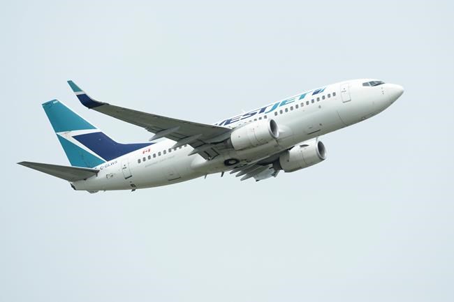 A WestJet plane takes off from Vancouver International Airport in Vancouver on Monday, May 13, 2019. Onex Corp. has signed a friendly deal to buy WestJet Airlines Ltd. in a transaction it valued at $5 billion, including assumed debt. THE CANADIAN PRESS/Jonathan Hayward