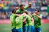 Seattle Sounders defender Roman Torres, top, and teammates mob defender Kelvin Leerdam, centre, (obscured) after scoring against the Toronto FC during second half MLS Cup soccer action in Seattle on Sunday, Nov. 10, 2019. THE CANADIAN PRESS/Jonathan Hayward