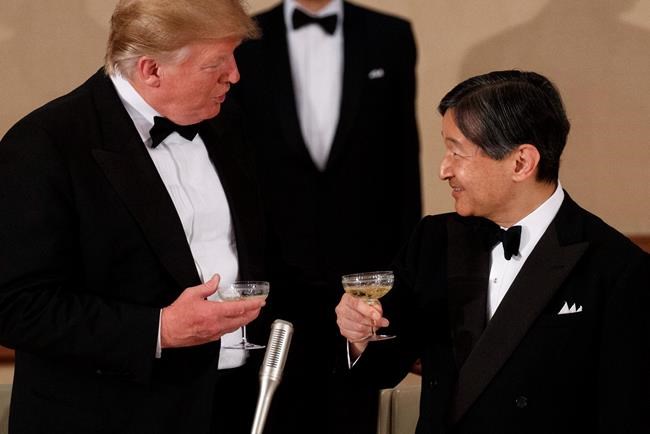 U.S. President Donald Trump toasts with Japan's Emperor Naruhito during a State Banquet at the Imperial Palace, Monday, May 27, 2019, in Tokyo. (AP Photo/Evan Vucci)