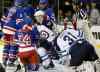 KATHY WILLENS / THE ASSOCIATED PRESS
New York Rangers' Dan Girardi (5) congratulates teammate Ryan Callahan (24) after Callahan scored on Winnipeg Jets goalie Ondrej Pavelec in the second period of an NHL game at Madison Square Garden in New York Monday. Jets defenceman Jacob Trouba (8) watches the replay onthe scoreboard.