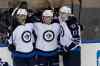 Anthony Gruppuso / USA Today Sports
Winnipeg Jets forward John Albert (centre) celebrates his goal with teammates Anthony Peluos (left) and James Wright during the second period.