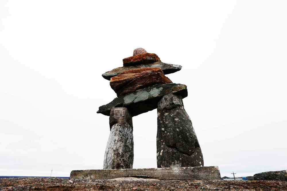 JOHN WOODS / WINNIPEG FREE PRESS
An Inukshuk looks over the town of Rankin Inlet.