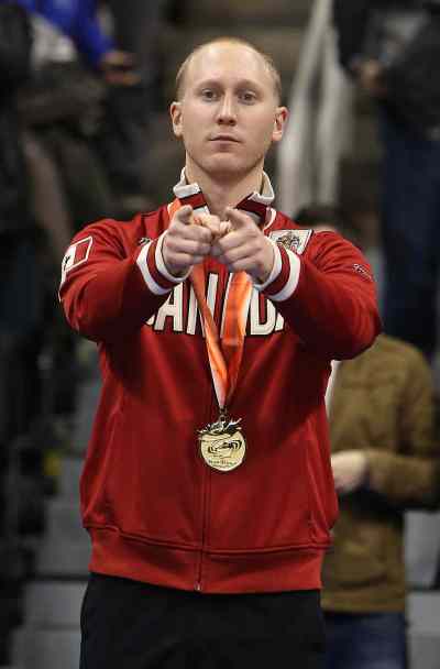 Jason Halstead / Winnipeg Free Press
Skip Brad Jacobs strikes a pose in his Team Canada apparel after defeating John Morris' team 7-4 in the men's final of Roar of the Rings Olympic Curling Trials at the MTS Centre on Sunday.
