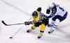 Winnipeg Jets defenseman Tyler Myers (57) tries to poke the puck away from Boston Bruins left wing Brad Marchand (63) during the first period of an NHL hockey game in Boston, Thursday, Oct. 8, 2015. (AP Photo/Charles Krupa)
