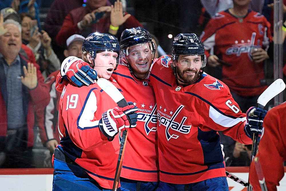 NICK WASS / THE ASSOCIATED PRESS
Washington Capitals center Nicklas Backstrom (19), of Sweden, celebrates his goal with defensemen John Carlson (74) and Michal Kempny (6), of the Czech Republic, during the first period of an NHL hockey game against the Winnipeg Jets, Sunday, March 10, 2019, in Washington.