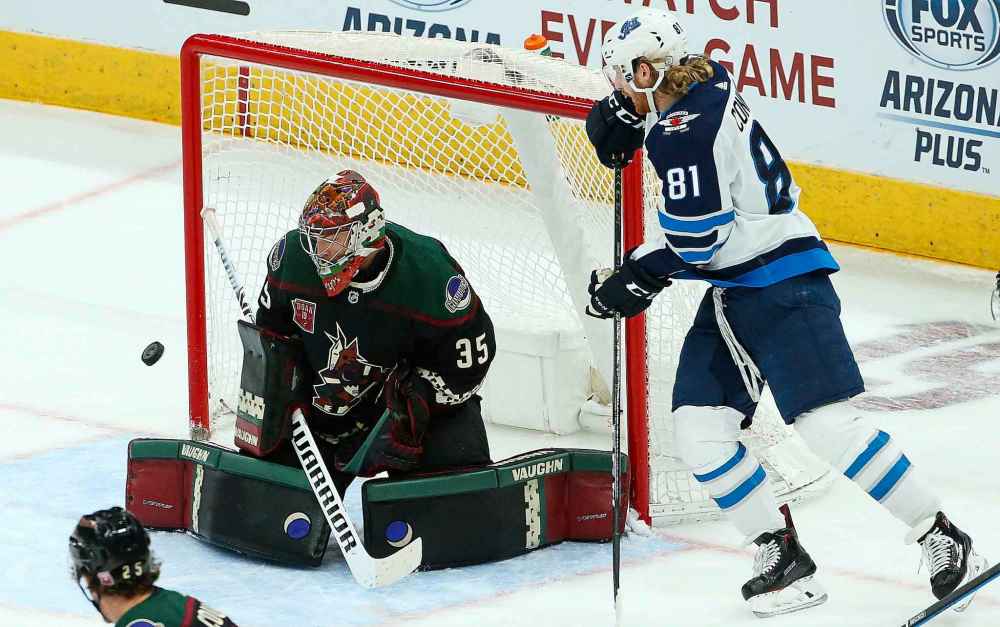ROSS D. FRANKLIN / THE ASSOCIATED PRESS
Arizona Coyotes goaltender Darcy Kuemper (35) makes a save on a shot by Winnipeg Jets left wing Kyle Connor (81) during the second period of an NHL hockey game Sunday, Feb. 24, 2019, in Glendale, Ariz.