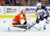 Tom Mihalek / AP
The puck goes wide of the net as Philadelphia Flyers' Steve Mason, left, fends off Winnipeg Jets' Mark Scheifele, right, during the first period of an NHL hockey game, Monday, March 28, 2016 in Philadelphia.
