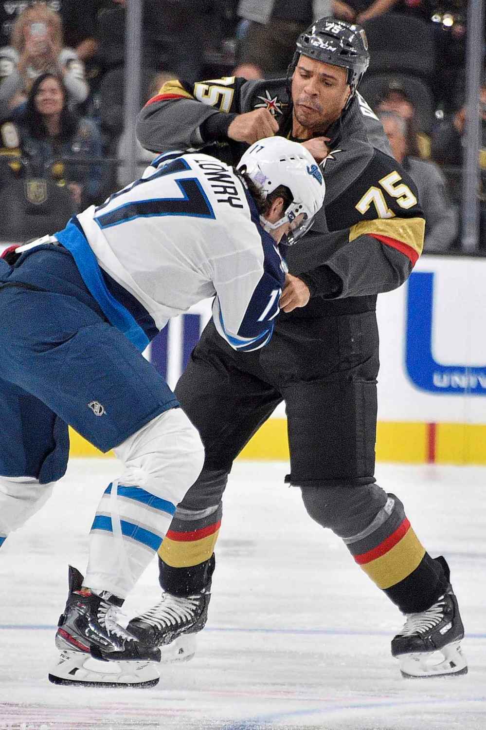 Winnipeg Jets center Adam Lowry (17) fights Vegas Golden Knights right wing Ryan Reaves during the second period of an NHL hockey game Saturday, Nov. 2, 2019, in Las Vegas. (AP Photo/David Becker)