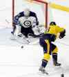 AP Photo/Mark Humphrey
Winnipeg Jets goalie Connor Hellebuyck (30) blocks a shot by Nashville Predators left wing James Neal (18) in the third period of an NHL hockey game Tuesday, Jan. 5, 2016, in Nashville, Tenn. The Jets won 4-1.