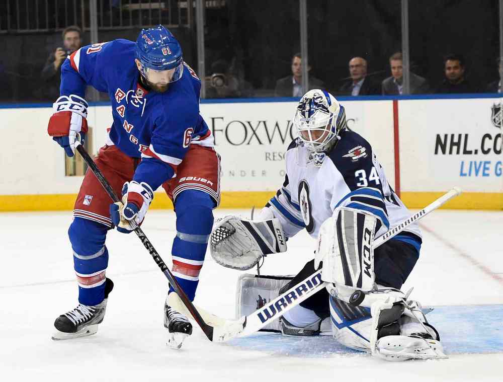 AP Photo/Kathy Kmonicek
Winnipeg Jets goalie Michael Hutchinson (34) blocks a shot on goal by New York Rangers left wing Rick Nash (61) during the second period of an NHL hockey game on Tuesday, Oct. 13, 2015, in New York.