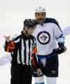 AP Photo/Tony Gutierrez
Referee Chris Lee (28) sends Winnipeg Jets' Dustin Byfuglien, right, to the penalty box for holding late in the third period of an NHL hockey game against the Dallas Stars on Thursday.
