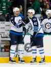 CP
Winnipeg Jets' Adam Pardy (2) congratulates Joel Armia (40) of Finland on his goal against the Dallas Stars in the closing seconds of the first period of an NHL hockey game, Thursday, Feb. 25, 2016, in Dallas. (AP Photo/Tony Gutierrez)