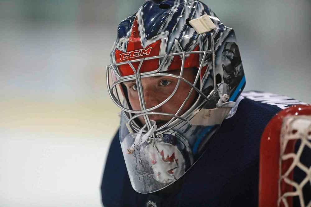 RUTH BONNEVILLE / WINNIPEG FREE PRESS 
Goalie Eric Comrie in net with other members of the Jets at MTS Iceplex Tuesday.