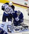 Mike Cassese / Reuters
Toronto Maple Leafs goalie James Reimer makes a save behind Winnipeg Jets forward Andrew Ladd during their game in Toronto Wednesday. The Jets face Ottawa next.