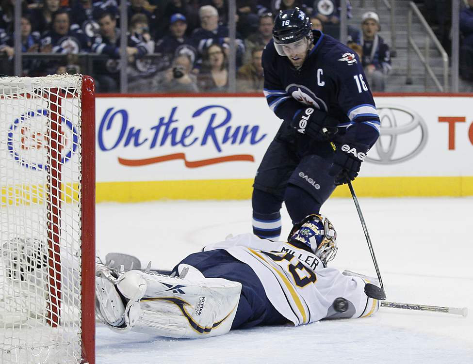 JOHN WOODS / Winnipeg Free Press Files
Andrew Ladd scores on Buffalo Sabres'  goaltender Ryan Miller in April of last year at the MTS Centre. This year, Ladd is one of nine Jets with 10 or more goals.