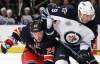 JIM MCISAAC / NEWSDAY/ MCT
The Jets’ Evander Kane controls the puck against the Rangers’ Ryan Callahan in their Sunday contest in New York.