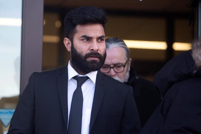 Jaskirat Singh Sidhu leaves provincial court in Melfort, Sask., Tuesday, January, 8, 2019. Sidhu, the driver of a transport truck involved in a deadly crash with the Humboldt Broncos junior hockey team's bus, has pleaded guilty to all charges against him. THE CANADIAN PRESS/Kayle Neis