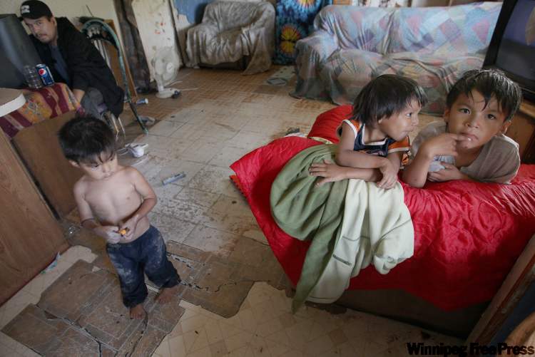 JOE BRYKSA / WINNIPEG FREE PRESS Archives
Kids inside the home of Richard Andrews in Wasagamack First Nation, which is under third-party management. The band needs about 450 more houses to alleviate chronic overcrowding.