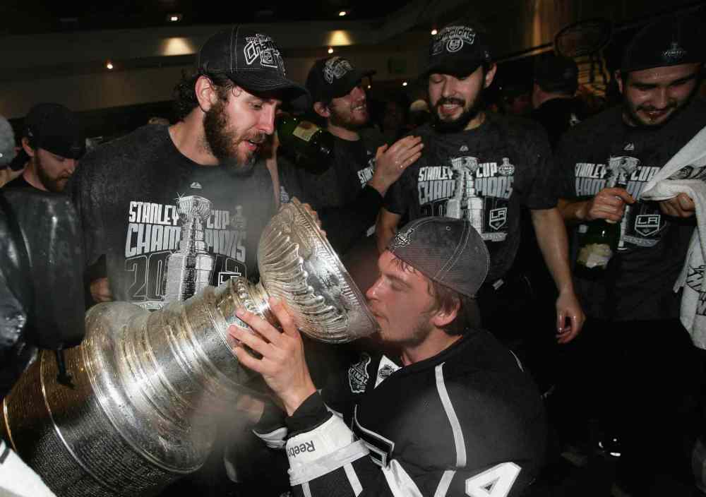 Dave Sandford / The Associated Press Files
In 2012, Los Angeles Kings' Mike Richards, Andrei Loktionov, Jonathan Quick and Drew Doughty celebrate with the Stanley Cup in the locker room after the Kings defeated the New Jersey Devils in game six of the NHL hockey Stanley Cup finals in Los Angeles.