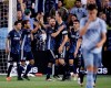 LA Galaxy forward Zlatan Ibrahimovic (9) celebrates with teammates after scoring a goal during the second half of an MLS soccer match against the Sporting Kansas City Wednesday, May 29, 2019, in Kansas City, Kan. LA Galaxy won 2-0. (AP Photo/Charlie Riedel)