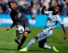 Philadelphia Union defender Ray Gaddis (28) kicks the ball past Sporting Kansas City forward Gerso (12) during the first half of an MLS soccer match in Kansas City, Kan., Sunday, March 10, 2019. (AP Photo/Orlin Wagner)
