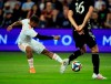 Atlanta United forward Josef Martinez (7) puts a shot past Sporting Kansas City midfielder Graham Smith (16) during the first half of an MLS soccer match in Kansas City, Kan., Sunday, May 5, 2019. (AP Photo/Orlin Wagner)