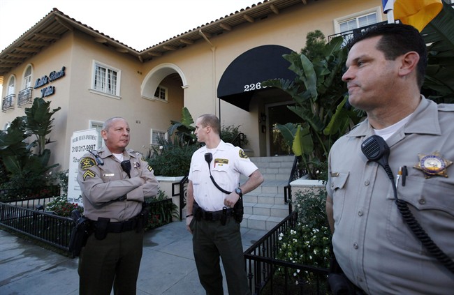 Los Angeles County Sheriff's officers stand outside an apartment building where Scott Sterling, the son of the Los Angeles Clippers owner Donald Sterling, lived in Malibu on Wednesday, Jan.2,2012. Scott Sterling was found dead of an apparent drug overdose at his Malibu home, authorities said Wednesday. (AP Photo/Nick Ut)