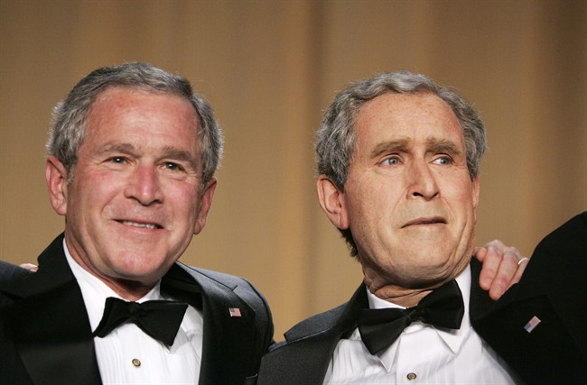 President George W. Bush, left, and Steve Bridges, a comedian and Bush impersonator pose during the White House Correspondents' Association's 92nd annual awards dinner in Washington in 2006. (AP Photo/Haraz N. Ghanbari, File)