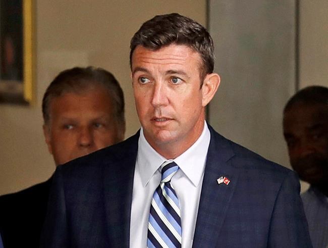 FILE - In this Aug. 23, 2018, file photo, Republican U.S. Rep. Duncan Hunter, R-Calif., leaves an arraignment hearing in San Diego after he and his wife, Margaret, pleaded not guilty to charges they illegally used his campaign account for personal expenses. Federal prosecutors say Hunter illegally used campaign funds to finance romantic flings with a series of women, spending thousands of dollars on meals, drinks and vacations. Allegations about the married Republican congressman's affairs were outlined in a government court filing late Monday, June 24, 2019, connected to charges he and his wife misspent more than $200,000 on trips and personal expenses. (AP Photo/Gregory Bull, File)