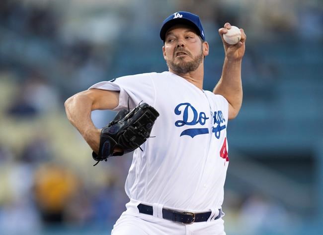 Los Angeles Dodgers starting pitcher Rich Hill throws during the first inning of the team's baseball game against the Chicago Cubs in Los Angeles, Friday, June 14, 2019. (AP Photo/Kyusung Gong)