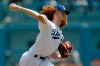 Los Angeles Dodgers starting pitcher Dustin May throws to a St. Louis Cardinals batter during the first inning of a baseball game in Los Angeles, Wednesday, Aug. 7, 2019. (AP Photo/Alex Gallardo)