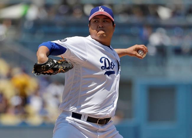 Los Angeles Dodgers starting pitcher Hyun-Jin Ryu throws to the Washington Nationals during the first inning of a baseball game Sunday, May 12, 2019, in Los Angeles. (AP Photo/Marcio Jose Sanchez)