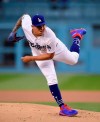 Los Angeles Dodgers starting pitcher Julio Urias follows through during the first inning of the team's baseball game against the Milwaukee Brewers on Friday, April 12, 2019, in Los Angeles. (AP Photo/Mark J. Terrill)