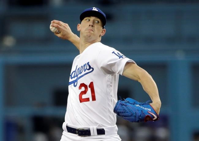 Los Angeles Dodgers starting pitcher Walker Buehler throws to a Colorado Rockies batter during the first inning of a baseball game Friday, June 21, 2019, in Los Angeles. (AP Photo/Marcio Jose Sanchez)