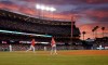 Los Angeles Angels' Kole Calhoun, second from left, rounds first after hitting a solo home run as Los Angeles Dodgers starting pitcher Ross Stripling, left, watches during the fourth inning of a baseball game Wednesday, July 24, 2019, in Los Angeles. (AP Photo/Mark J. Terrill)