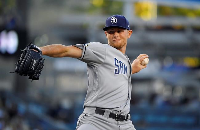 San Diego Padres starting pitcher Eric Lauer throws during the first inning of the team's baseball game against the Los Angeles Dodgers on Friday, Aug. 2, 2019, in Los Angeles. (AP Photo/Mark J. Terrill)