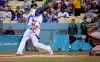 Los Angeles Dodgers' Joc Pederson hits a solo home run as San Francisco Giants catcher Buster Posey watches during the first inning of a baseball game Tuesday, June 18, 2019, in Los Angeles. (AP Photo/Mark J. Terrill)
