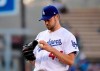 Los Angeles Dodgers' Rich Hill gets set to pitch during the first inning of the team's baseball game against the San Francisco Giants on Wednesday, June 19, 2019, in Los Angeles. (AP Photo/Mark J. Terrill)