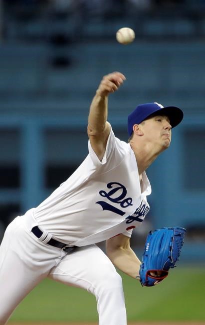 Los Angeles Dodgers starting pitcher Walker Buehler throws to a Colorado Rockies batter during the first inning of a baseball game Friday, June 21, 2019, in Los Angeles. (AP Photo/Marcio Jose Sanchez)