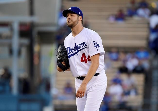 Los Angeles Dodgers' Rich Hill reacts after a pitch during the first inning of the team's baseball game against the San Francisco Giants on Wednesday, June 19, 2019, in Los Angeles. Hill was taken out of the game with an injury before the second inning started. (AP Photo/Mark J. Terrill)