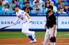 Los Angeles Dodgers' Joc Pederson, left, heads to first after hitting a solo home run as Miami Marlins starting pitcher Sandy Alcantara watches during the first inning of a baseball game Saturday, July 20, 2019, in Los Angeles. (AP Photo/Mark J. Terrill)