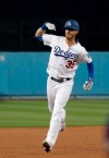 Los Angeles Dodgers' Cody Bellinger celebrates as he rounds the bases after hitting a two-run home run against the Pittsburgh Pirates during the first inning of a baseball game Friday, April 26, 2019, in Los Angeles. (AP Photo/Marcio Jose Sanchez)