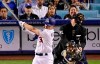 Home plate umpire Brian Knight, upper right, has his mask knocked off by a foul tip hit by Los Angeles Dodgers' Joc Pederson, left, next to Milwaukee Brewers catcher Yasmani Grandal during the first inning of a baseball game Friday, April 12, 2019, in Los Angeles. Knight left the game for a concussion protocol. (AP Photo/Mark J. Terrill)